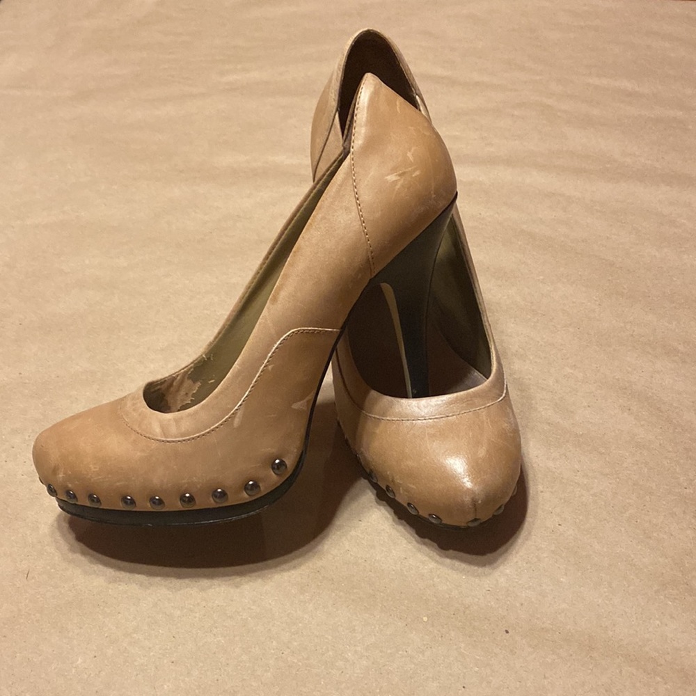 Distressed Tan Aldo heels.